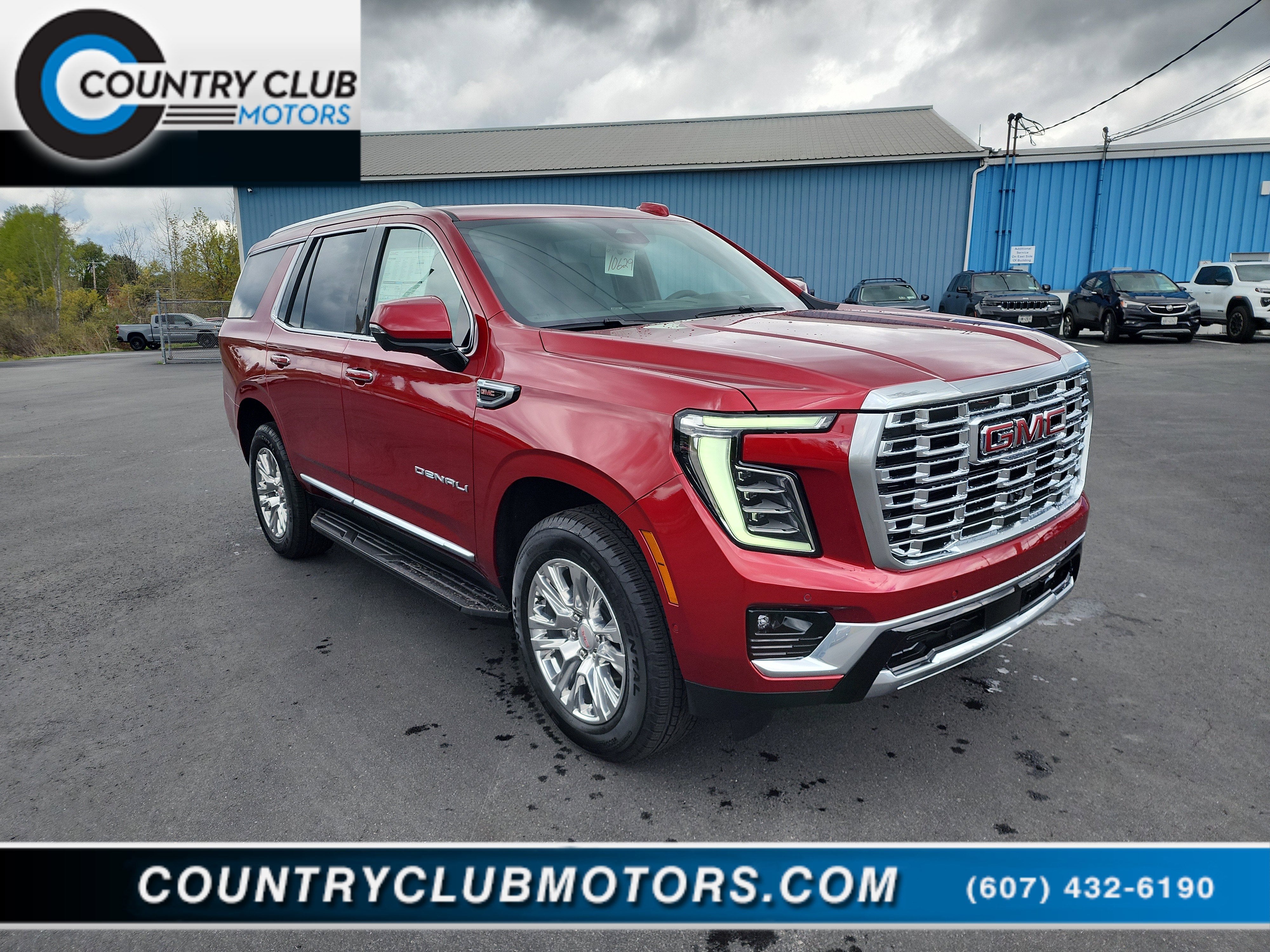 2026 GMC Yukon Denali in Volcanic Red Tintcoat — front three-quarter view