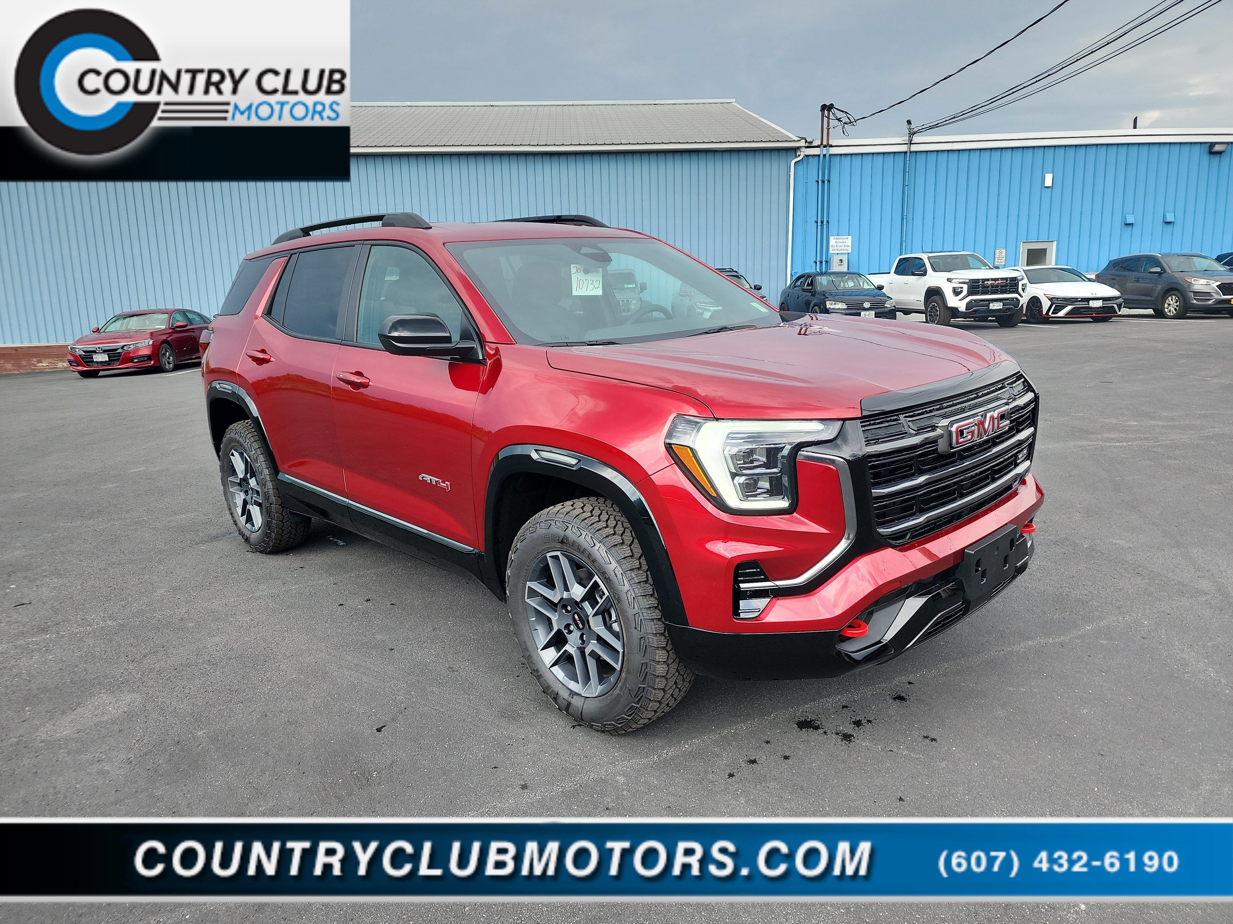2026 GMC Terrain AT4 in Volcanic Red Tintcoat — front three-quarter view